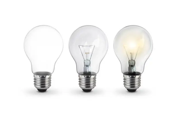 Photo of lighted bulb isolated on white background