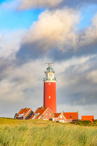 Lighthouse at the Wadden island Texel in the dunes during a stormy autumn morning. The Eierland lighthouse is located at the North point of the island.