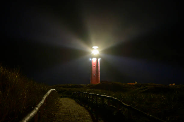istock Texel lighthouse in the dunes during a stormy autumn night 1390045515