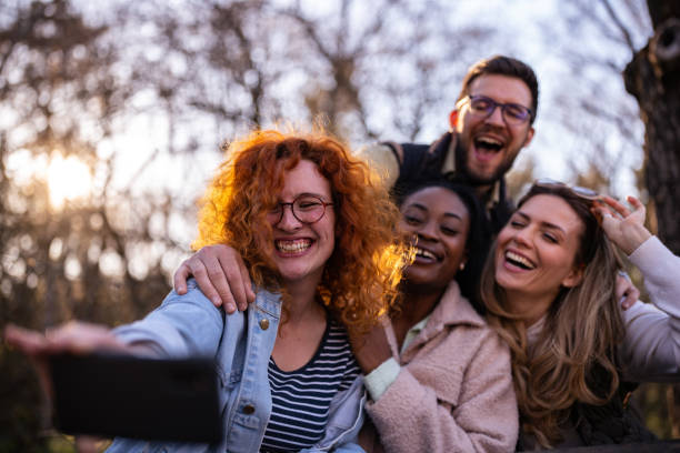 istock Young people in the nature taking selfies 1390046760