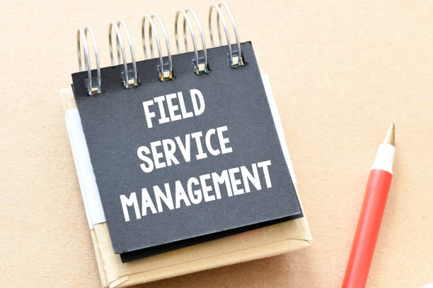 istock Field Service Management words in an office notebook. 1390048582