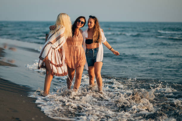 Friends are brothers and sisters we choose for ourselves! Three best friends enjoy the sea