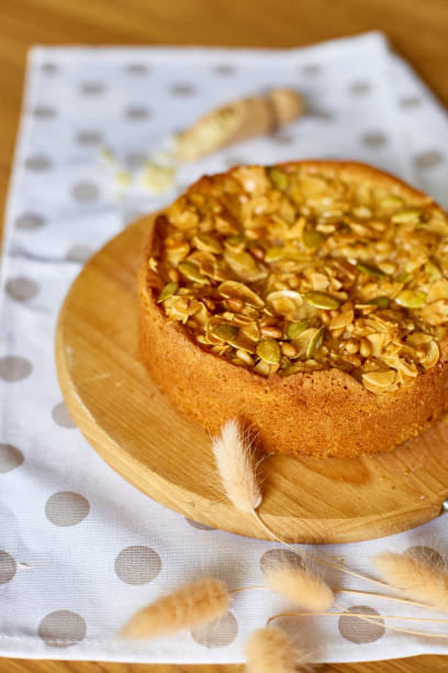 istock Apple or pear pie, tart with caramel nuts on wooden table, copy space, top view. 1390054093