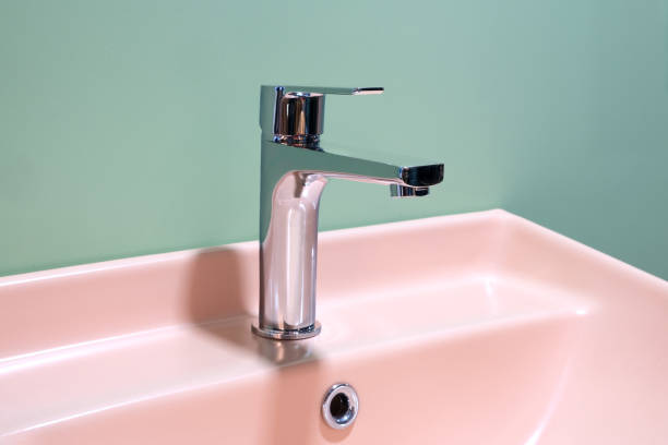 istock Bathroom interior with sink and faucet. 1390058128