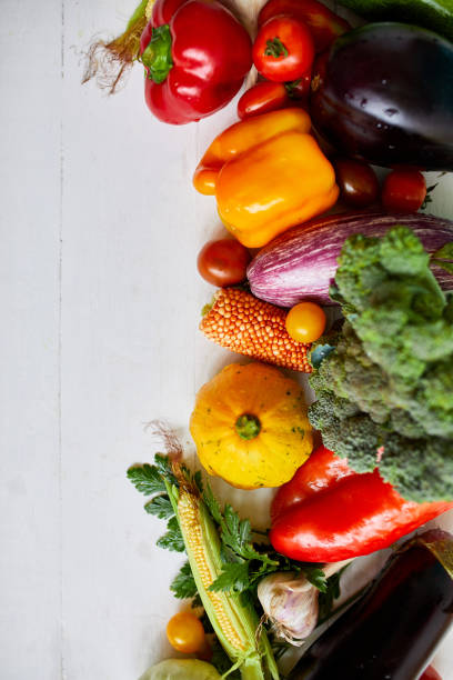 istock Top view assorted fresh organic vegetables on table in the kitchen in sunlight, grocery healthy shopping, vegan foodÐ± flat lay, copy space. Layout with free text 1390060247
