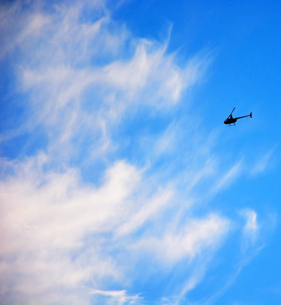 istock Military Helicopter against cloudy sky. Military scene 1390062005