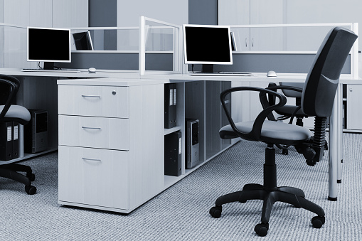 workplaces with computers in modern office