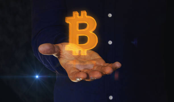 istock Bitcoin blockchain crypto currency symbol over hand 1390062606