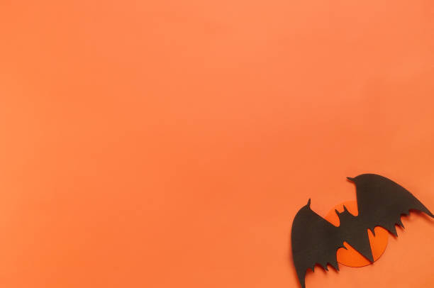 istock Bat on the Orange Background 1390064032
