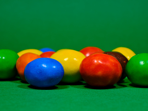 Close up of a pile of colorful chocolate coated candy