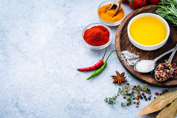istock Olive oil, spices and condiments border. Copy space 1390064455