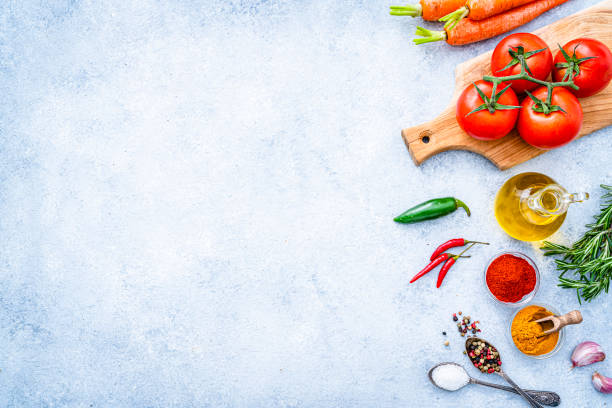 Cooking and seasoning background: vegetables, herbs and spices stock photo