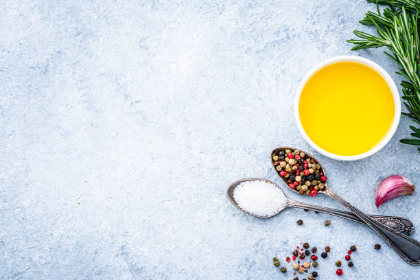 istock Olive oil, salt and pepper shot from above. Copy space 1390064486
