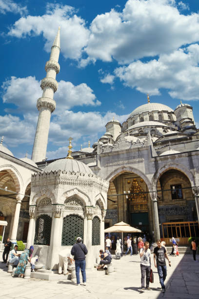 New Mosque (Yeni Cami), Istanbul, Turkey Istanbul, Turkey - June 6, 2012: People visiting New Mosque (Yeni Cami), an Ottoman imperial mosque located in the Eminonu quarter of Istanbul, Turkey. azan stock pictures, royalty-free photos & images