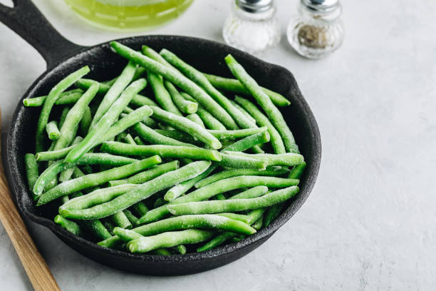 istock Frozen green beans in a pan ready for cooking 1390066207