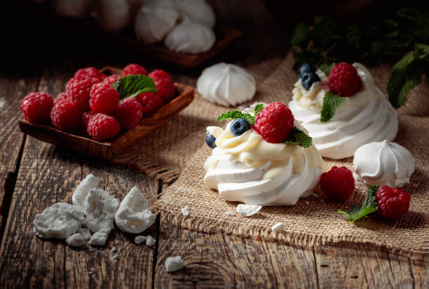 istock Dessert Pavlova with raspberries, blueberries and mint. 1390066268