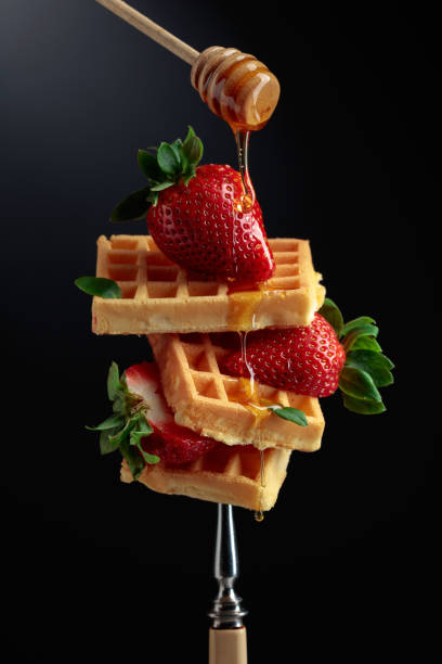 istock Waffles with strawberries and honey. 1390066273