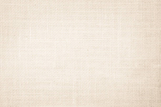 istock Jute hessian sackcloth burlap canvas woven texture background pattern in light beige cream brown color blank. Natural weaving fiber linen and cotton cloth texture as clean empty for decoration. 1390067209
