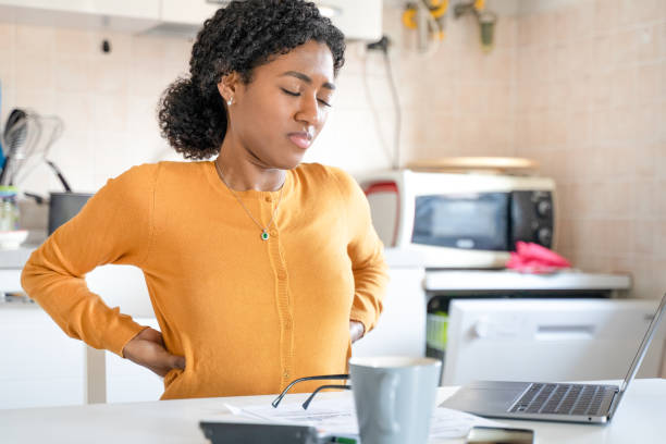 istock One black woman working at home suffering back pain 1390067999