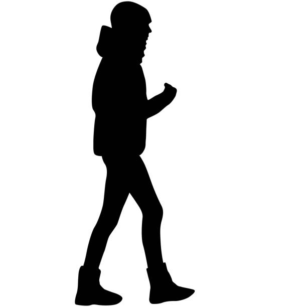 istock Silhouette of a walking girl on a white background 1390069918