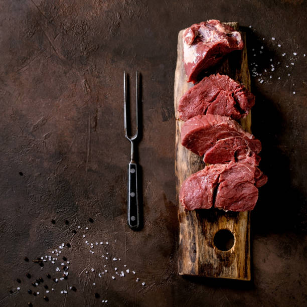 istock Fresh whole raw beef tenderloin on wooden board 1390069970