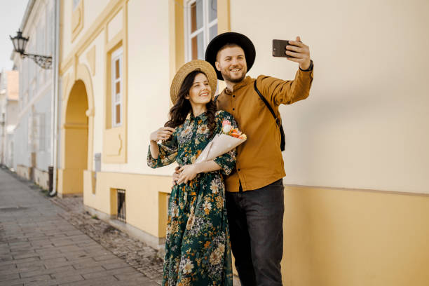 istock Young travel couple taking a selfie 1390072381