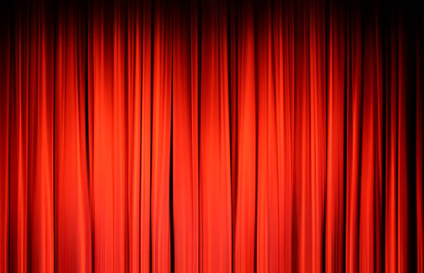 istock Red curtain on the stage, background, texture. 1390073901