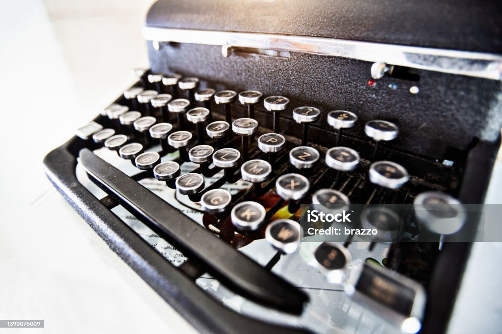 Typewriter Old black typewriter on white background Alphabet Stock Photo