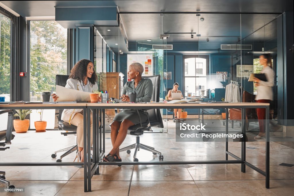 Shot of a group of female designers working in an office What do you think of this? Office Stock Photo