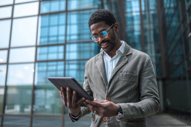 istock African American Businessman in 40s Using A Digital Tablet 1390077960