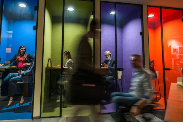 istock Lovely Colorful Private Offices in A Busy Environment 1390077978