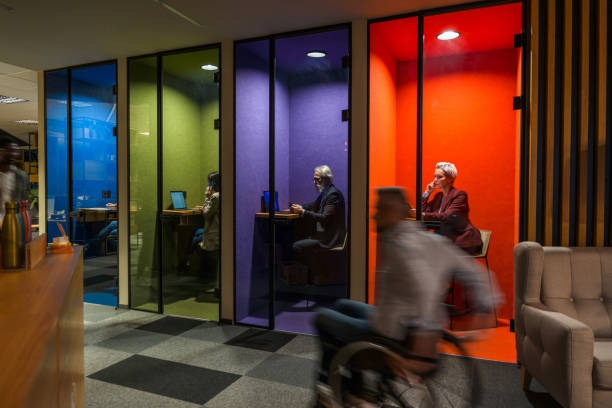 istock Lovely Colorful Private Offices in A Busy Environment 1390077994