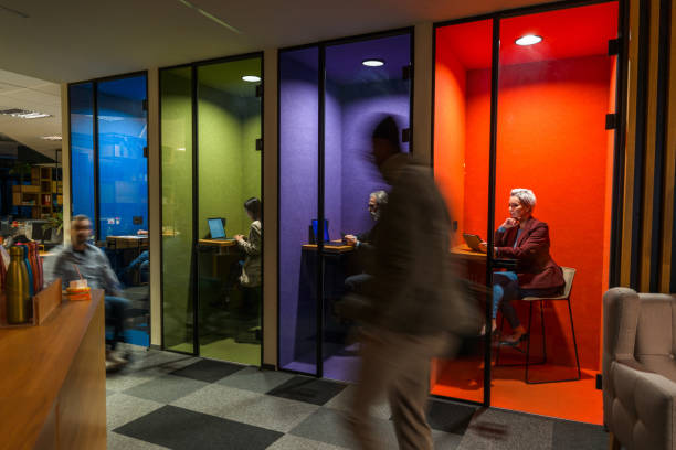 istock Business People Walking Quickly Passing Small Private Colorful Offices 1390077995