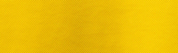 istock Yellow fabric cloth polyester texture and textile background, Wide banner 1390079624