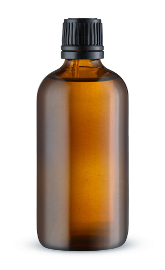Brown glass essential oil bottle isolated on white background. Cosmetic container. Mockup without label