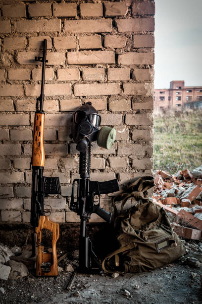 istock sniper rifle, automatic rifle and gas mask 1390080825
