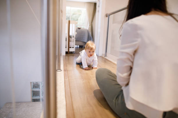 istock Baby crawling towards its mother 1390083886