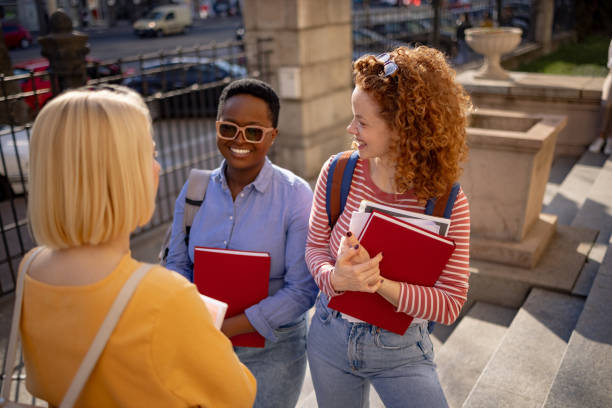 istock Three female students hanging out after class 1390088074