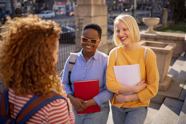 istock Three female students hanging out after class 1390088141