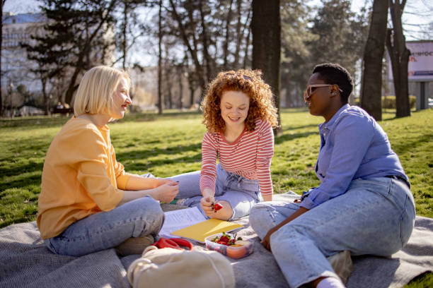 istock Small group of female students getting together for a picnic 1390088763