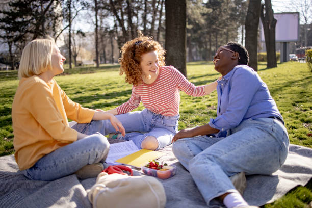istock Small group of female students getting together for a picnic 1390088788