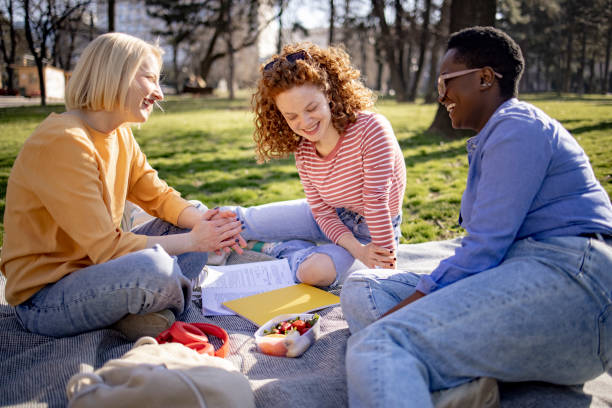 istock Small group of female students getting together for a picnic 1390088796