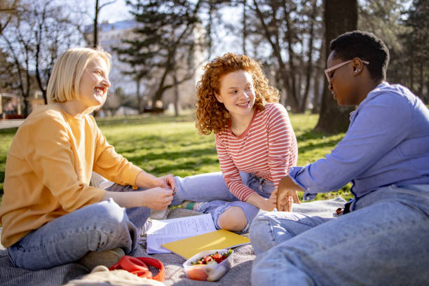 istock Small group of female students getting together for a picnic 1390088799