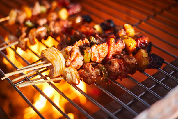 istock barbecue grill with smoke and flames 1390091629