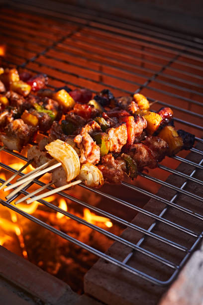istock barbecue grill with smoke and flames 1390091819