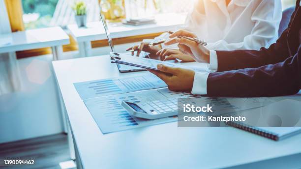 Closeup Of Two Businesswomen Calculating Financial Statements At A Desk Stock Photo - Download Image Now