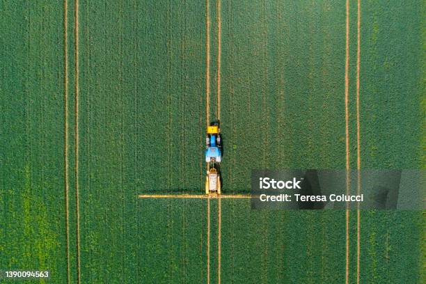 Aerial View Of Farming Tractor Crop Sprayer In The Countryside Stock Photo - Download Image Now