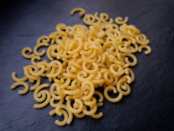 istock Small pasta noodles on slate plate from above 1390094811