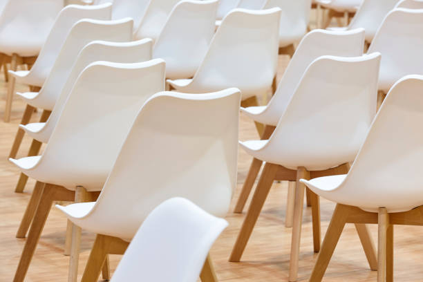 istock White chairs on a conference room. Modern business workspace indoor. 1390099193