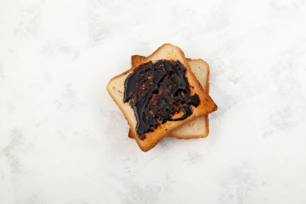 Photo of Aussie savory toasts for breakfast. Vegemite is a very popular yeast based spread in Australia